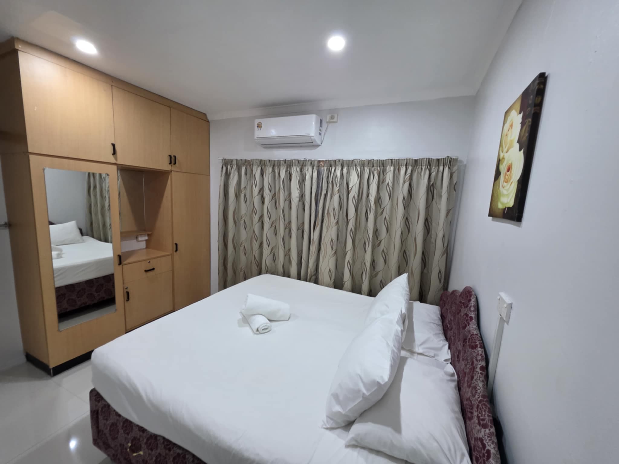 A bedroom in the PVV Two Bedroom Apartment.